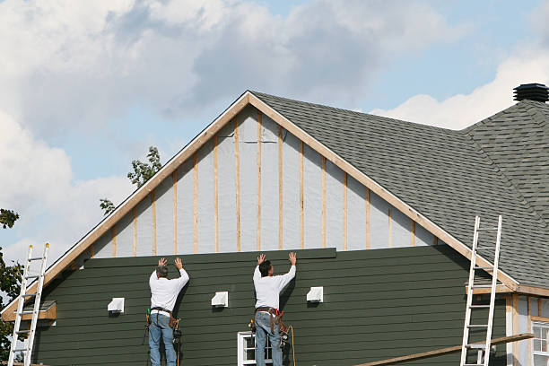 Professional Storm Damage Siding Repair technician working in Clearville, PA